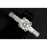 a 0,80 carat high quality brilliant cut diamond set in a ring in white gold (18 carat) with more