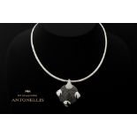 Antonellis signed pendant in yellow and white gold (18 carat) with at least 4,20 carat of black