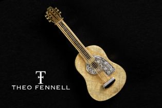 Theo Fennell signed "Guitar" shaped pendant/brooch in white and yellow gold (18 carat) with