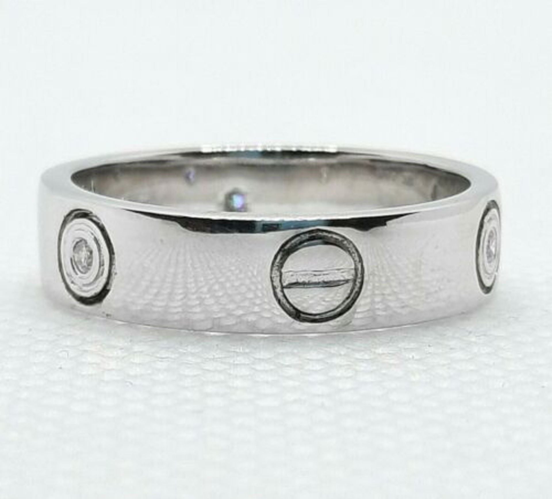 WHITE GOLD DIAMOND WEDDING BAND. SCREW MOTIFS