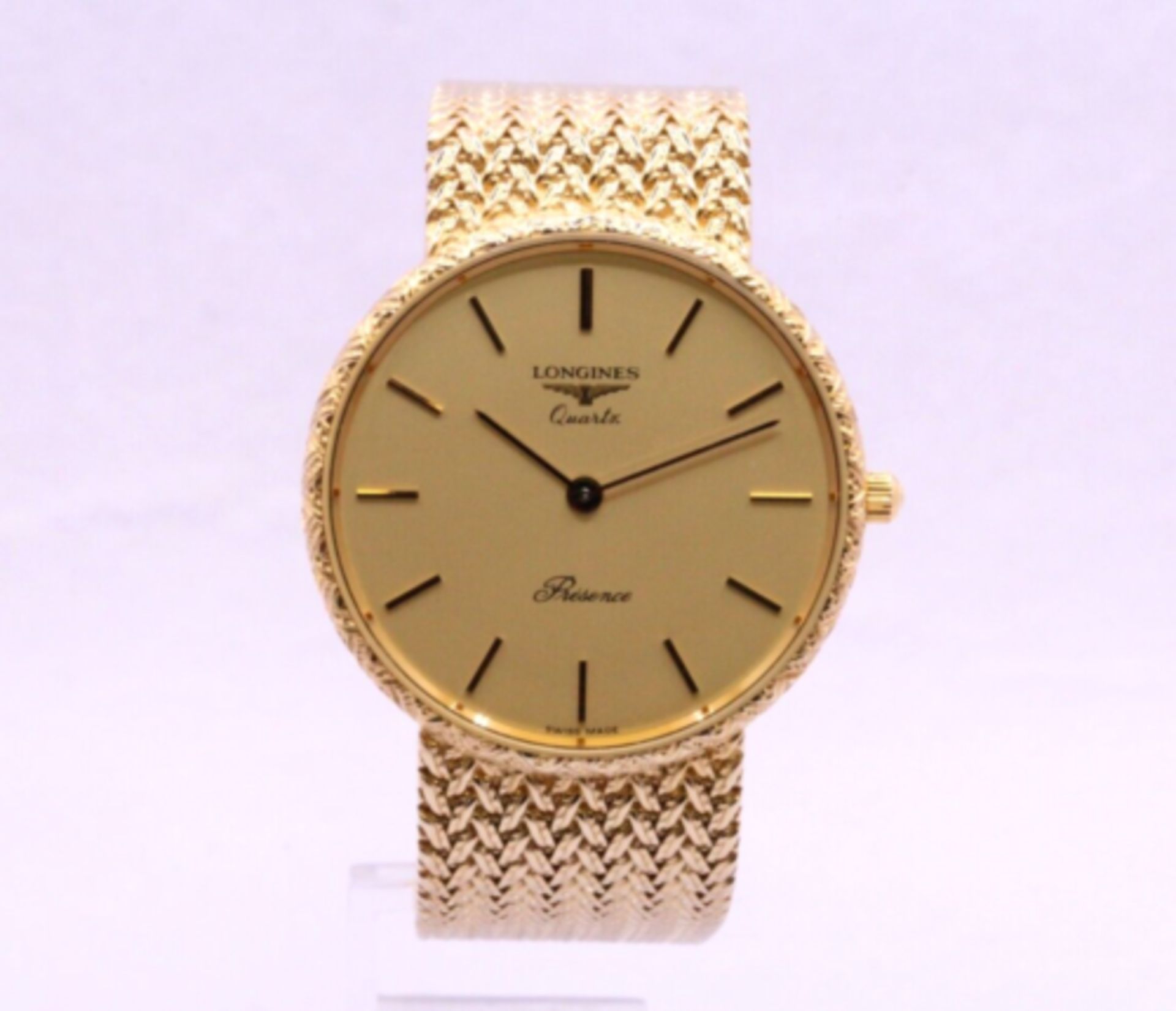 NOS LONGINES PRESENCE 9K GOLD QUARTZ WATCH 33MM 24.321.523 GENTS 375 7.5"