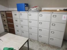 Seven 4 drawer filing cabinets.