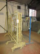 Nine various paint hanging trolleys / stands