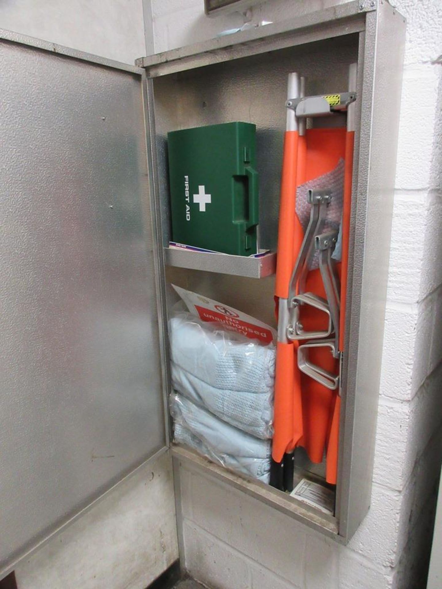 Wall mounted First Aid cabinet with stretcher etc.