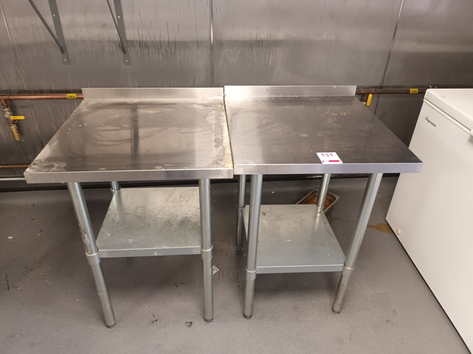 Two square stainless steel tables (Located Northampton)