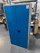 Two door metal cabinet with contents to include a large quantity of valve and pipe brackets (1", 3/8