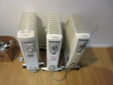 Three mobile oil filled electric radiators