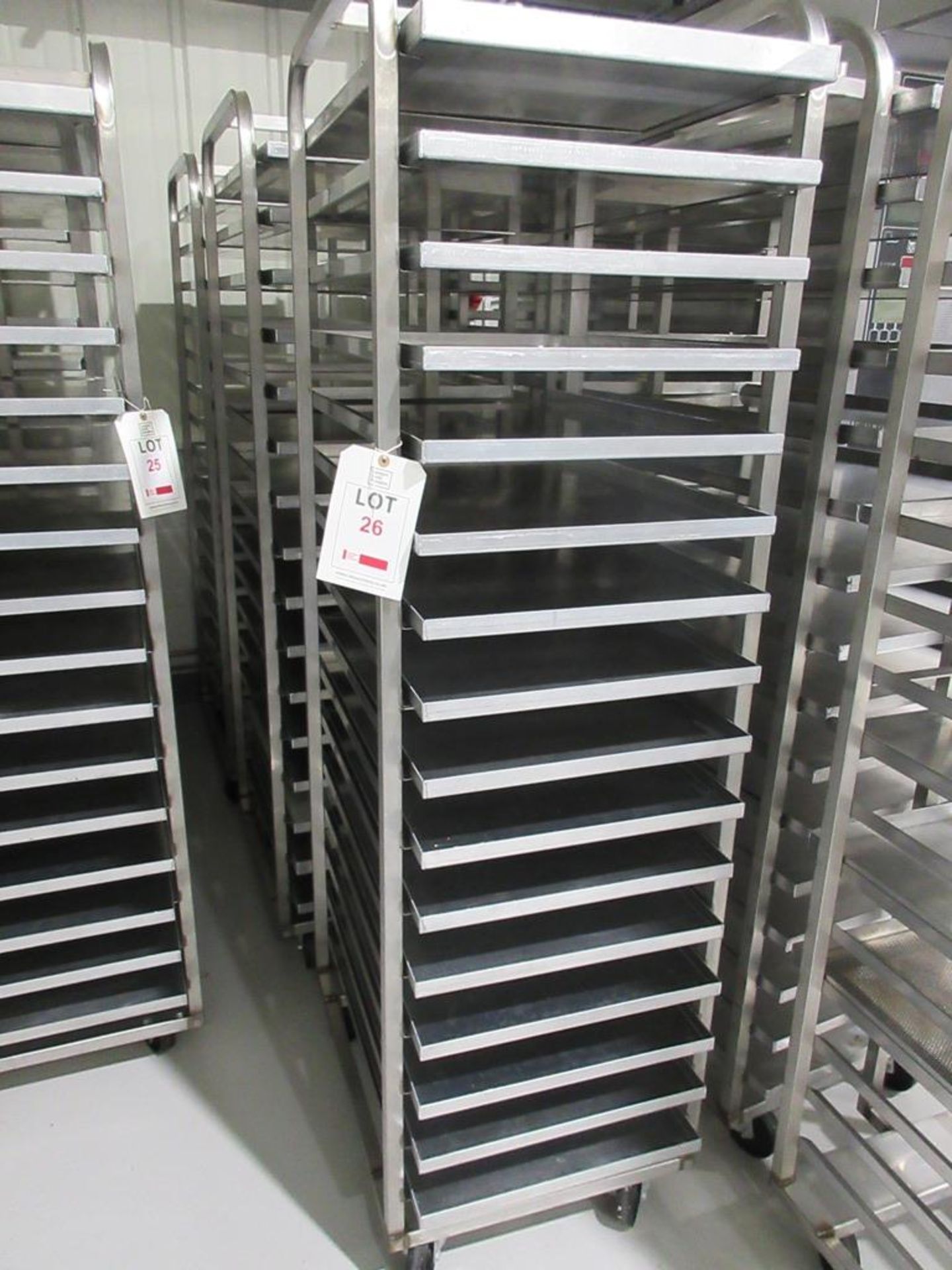 Three stainless Steel mobile 16 compartment tray racks, 530mm x 760mm x 1800mm