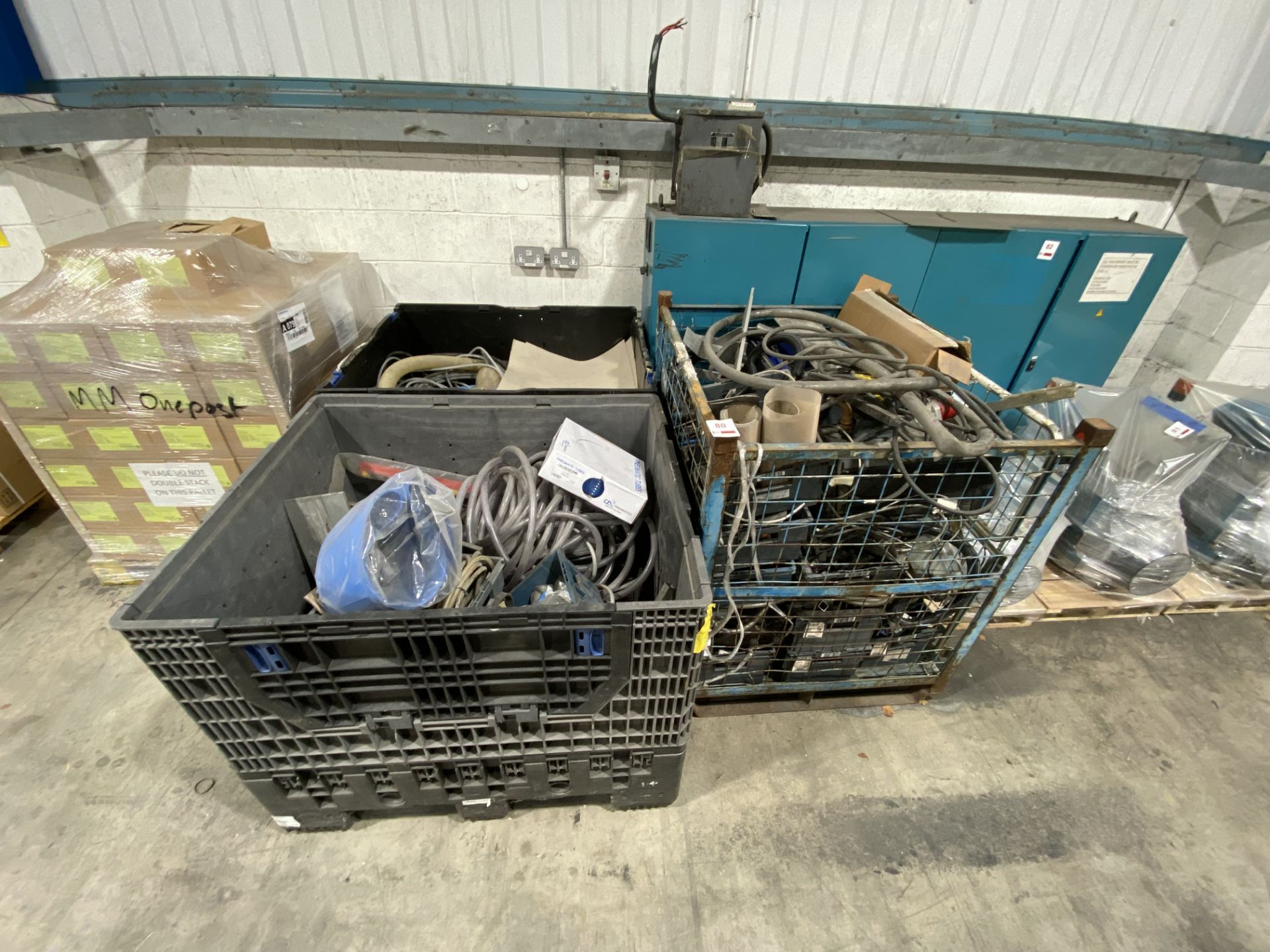 Three bins of assorted hosing, cabling and machine sundries