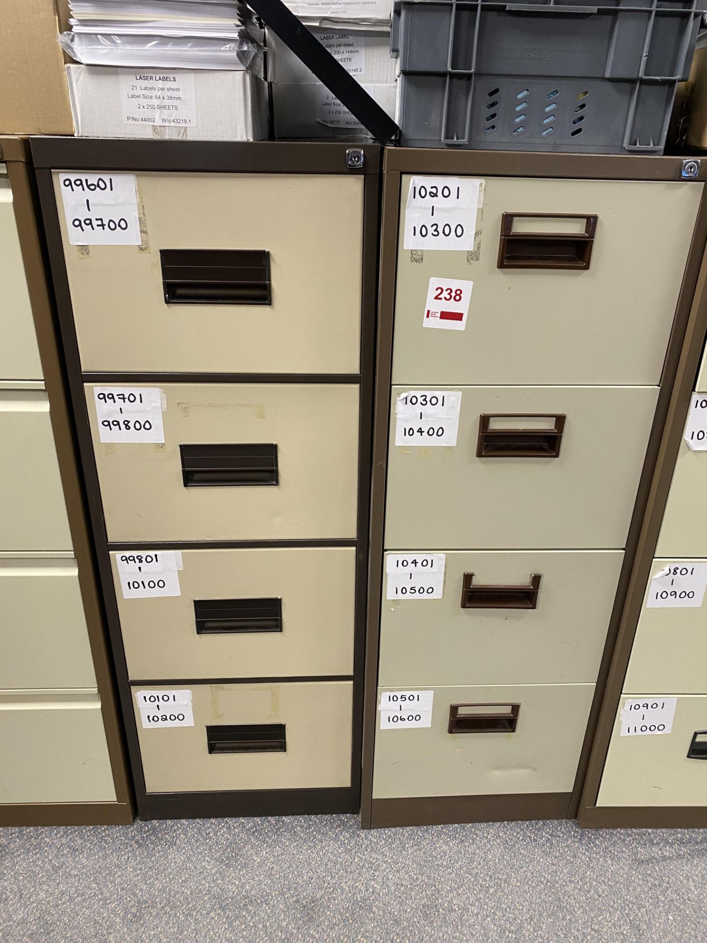 Two 4-drawer metal filing cabinets