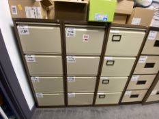 Three 4-drawer metal filing cabinets