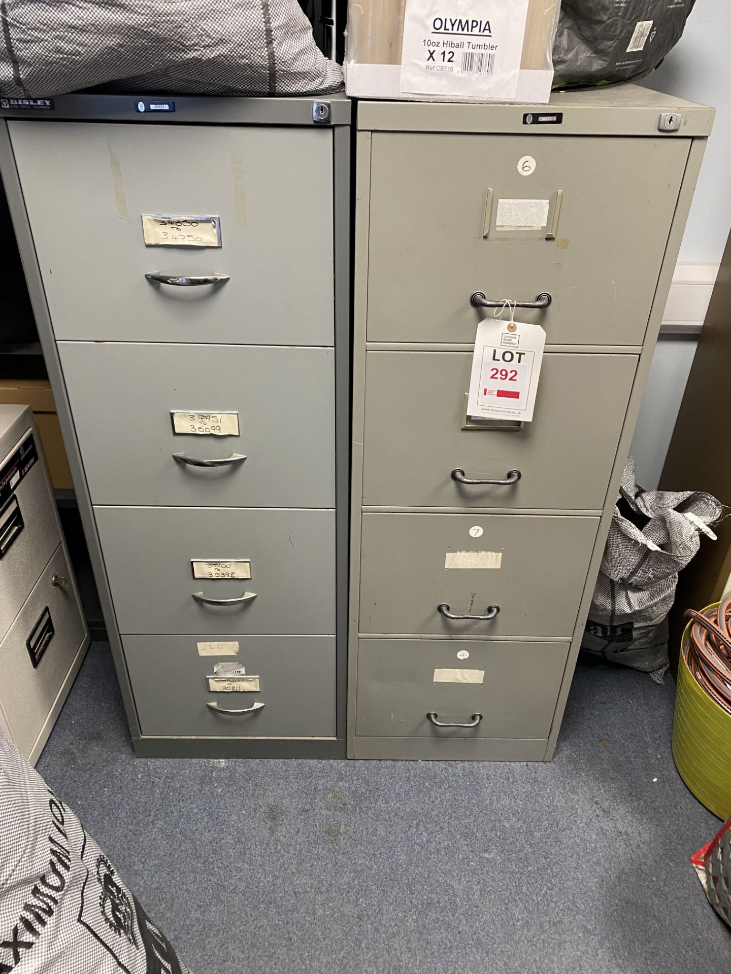 Two metal 4-door filing cabinets, both unlocked, no keys