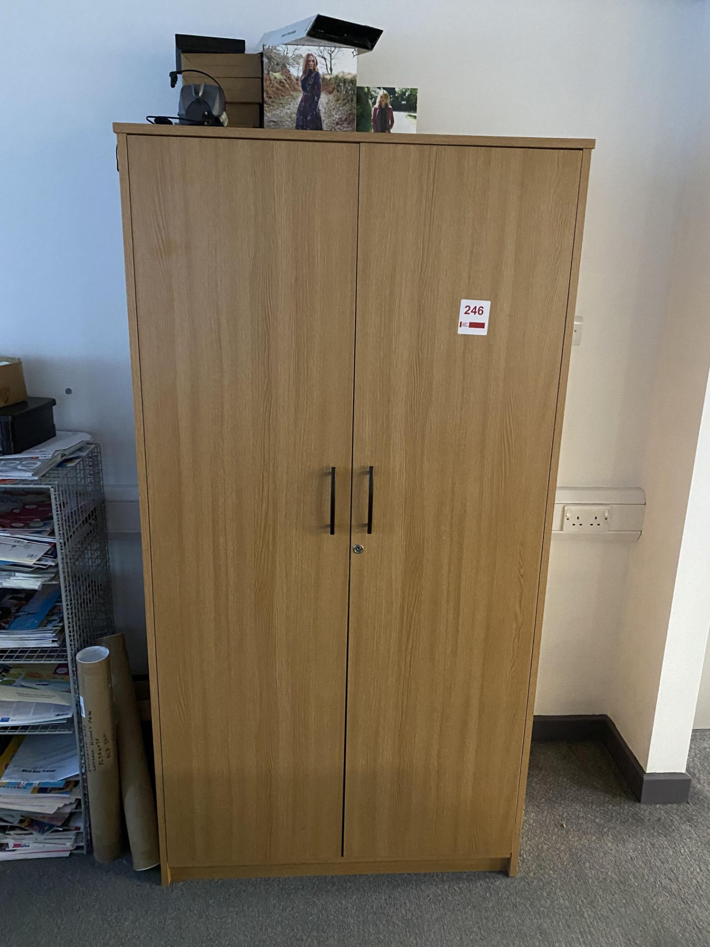 Two wood effect storage cupboards