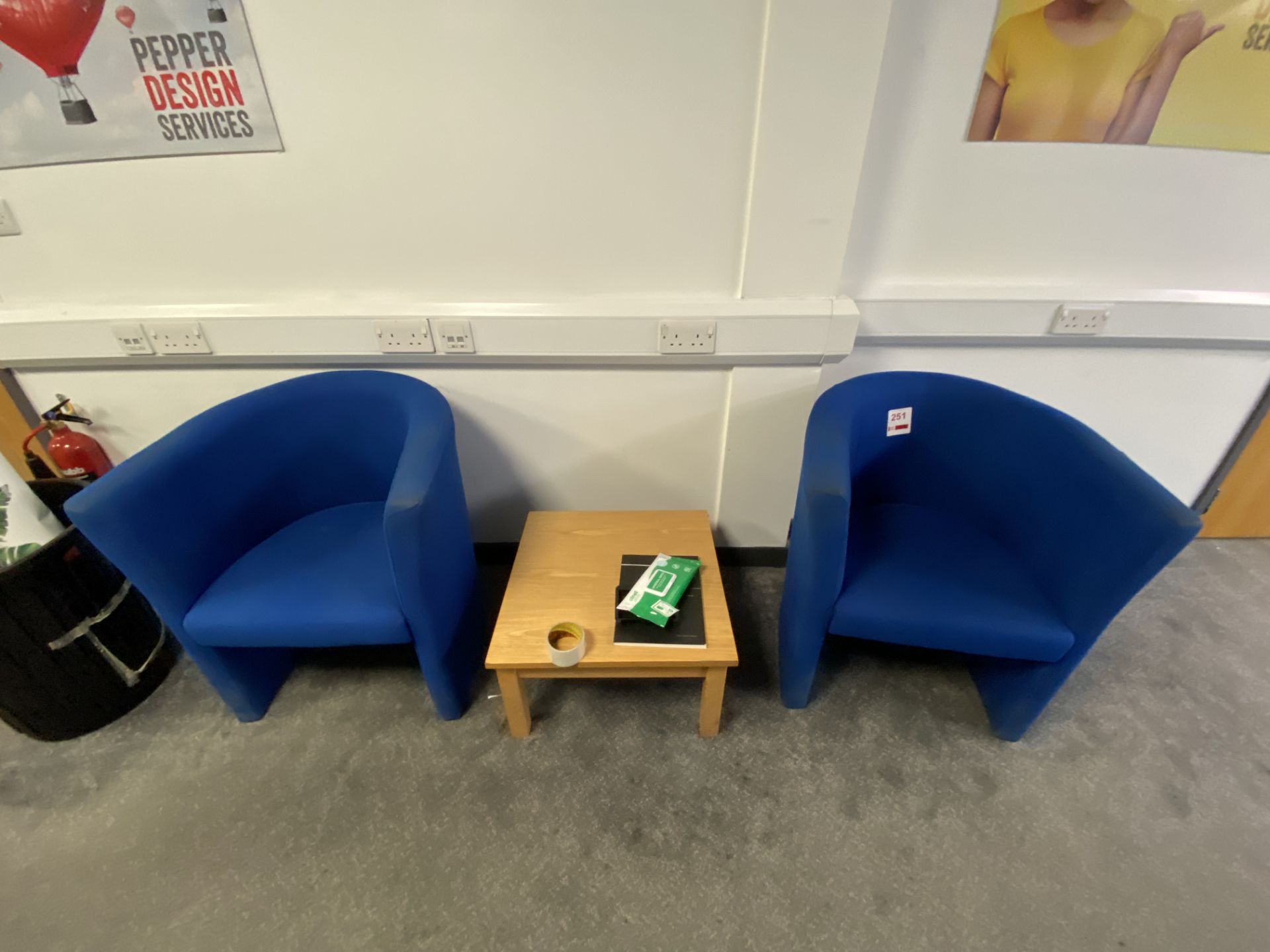 Three blue upholstered tub chairs & small table