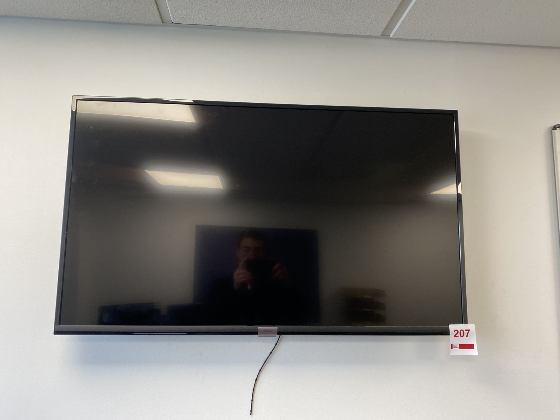 TCL TV, approx 40", with remote control