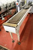 Steel frame horizontal gravity fed conveyor section, approx 3m length, approx 300mm width,