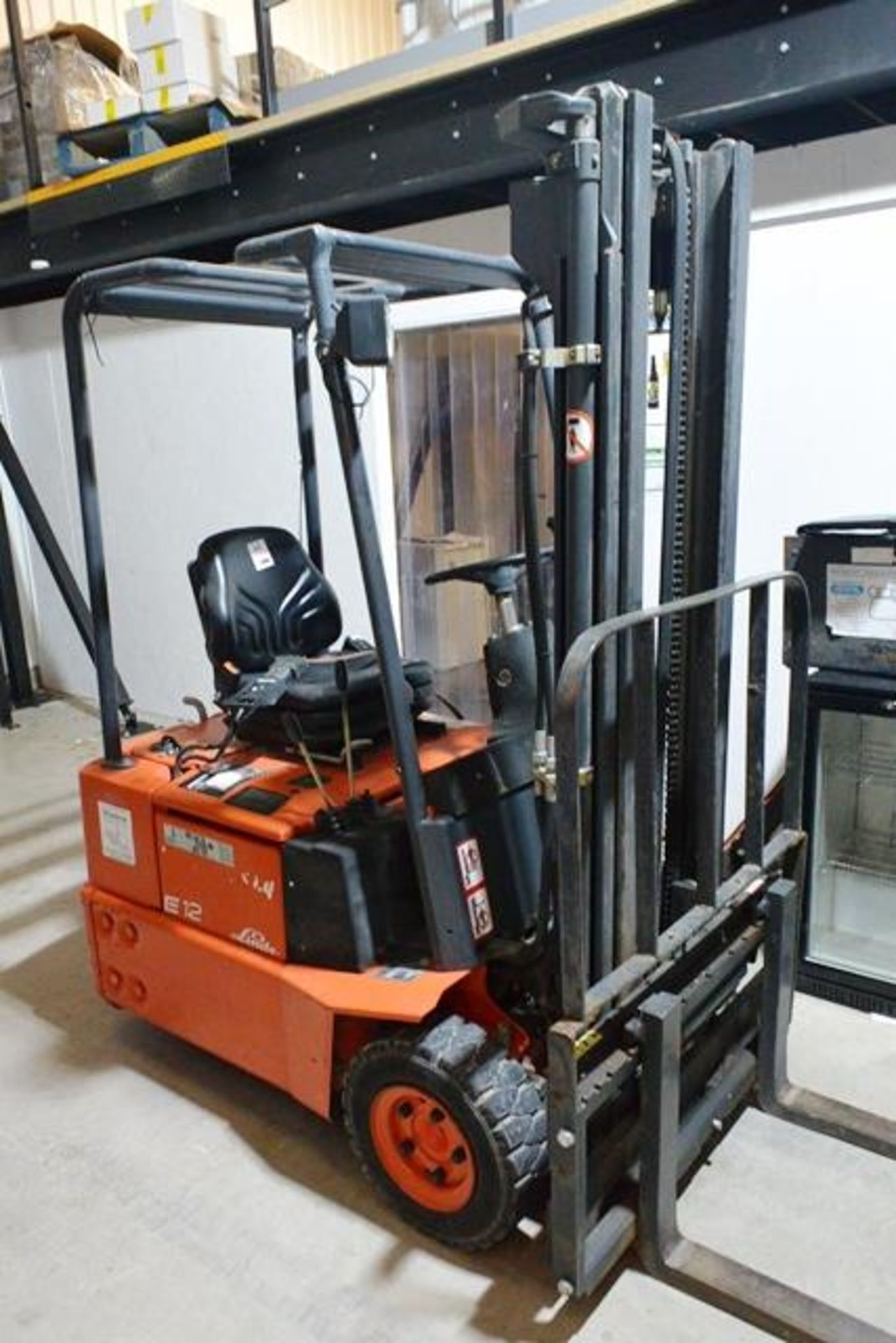 Lansing Linde E12-02 triple wheel, battery operated ride on forklift truck, side shift, serial no.