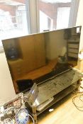 Panasonic TX55CXU00b 55" TV, with TV stand. This Lot is Located: Black Tor Brewery, Units 5 & 6,