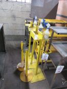 Three metal frame cleaning stations, two barrier posts with chain