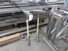 Two metal single roller stands