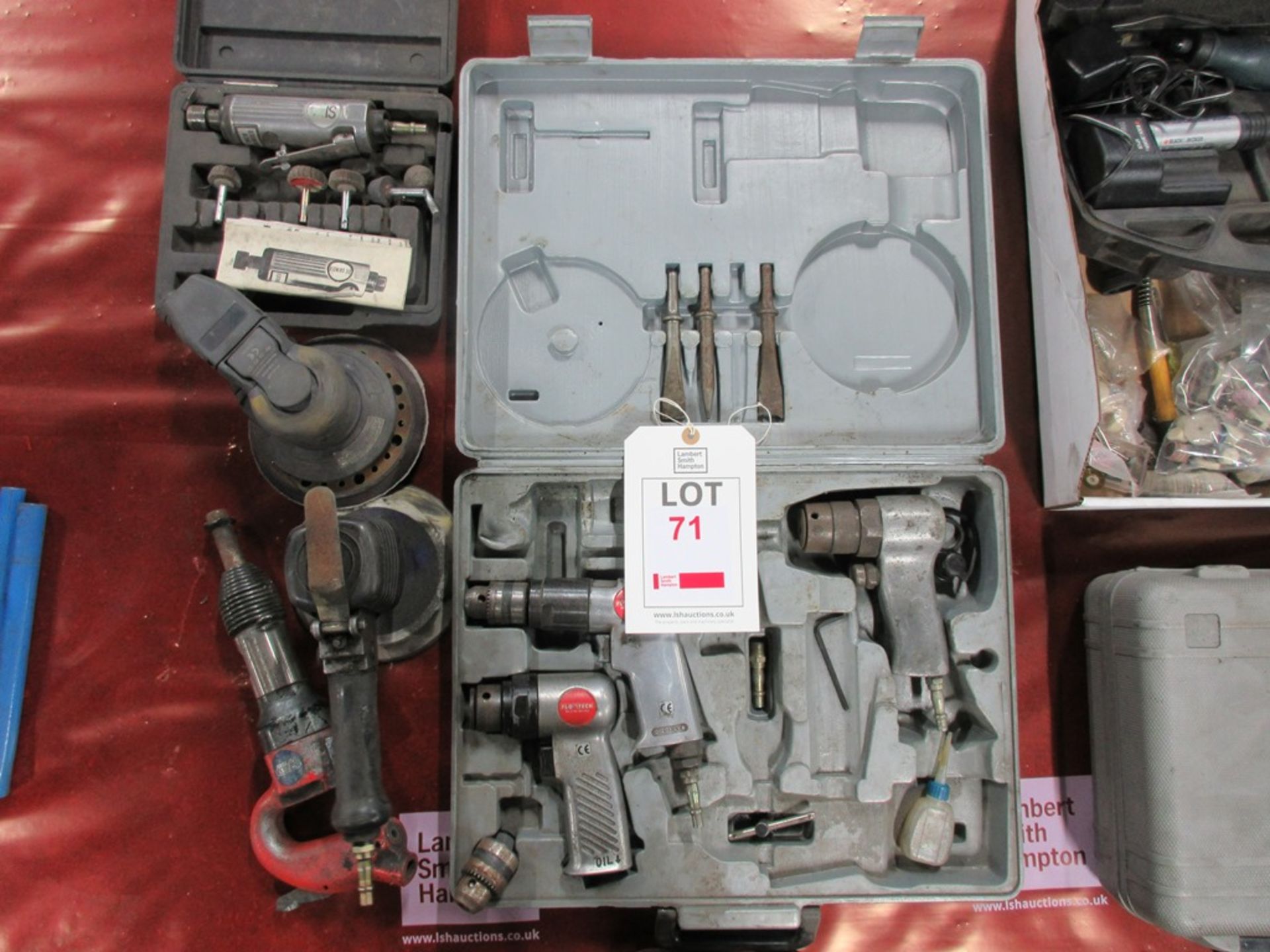 Assorted pneumatic hand tools including pistol drills, palm sanders, etc.