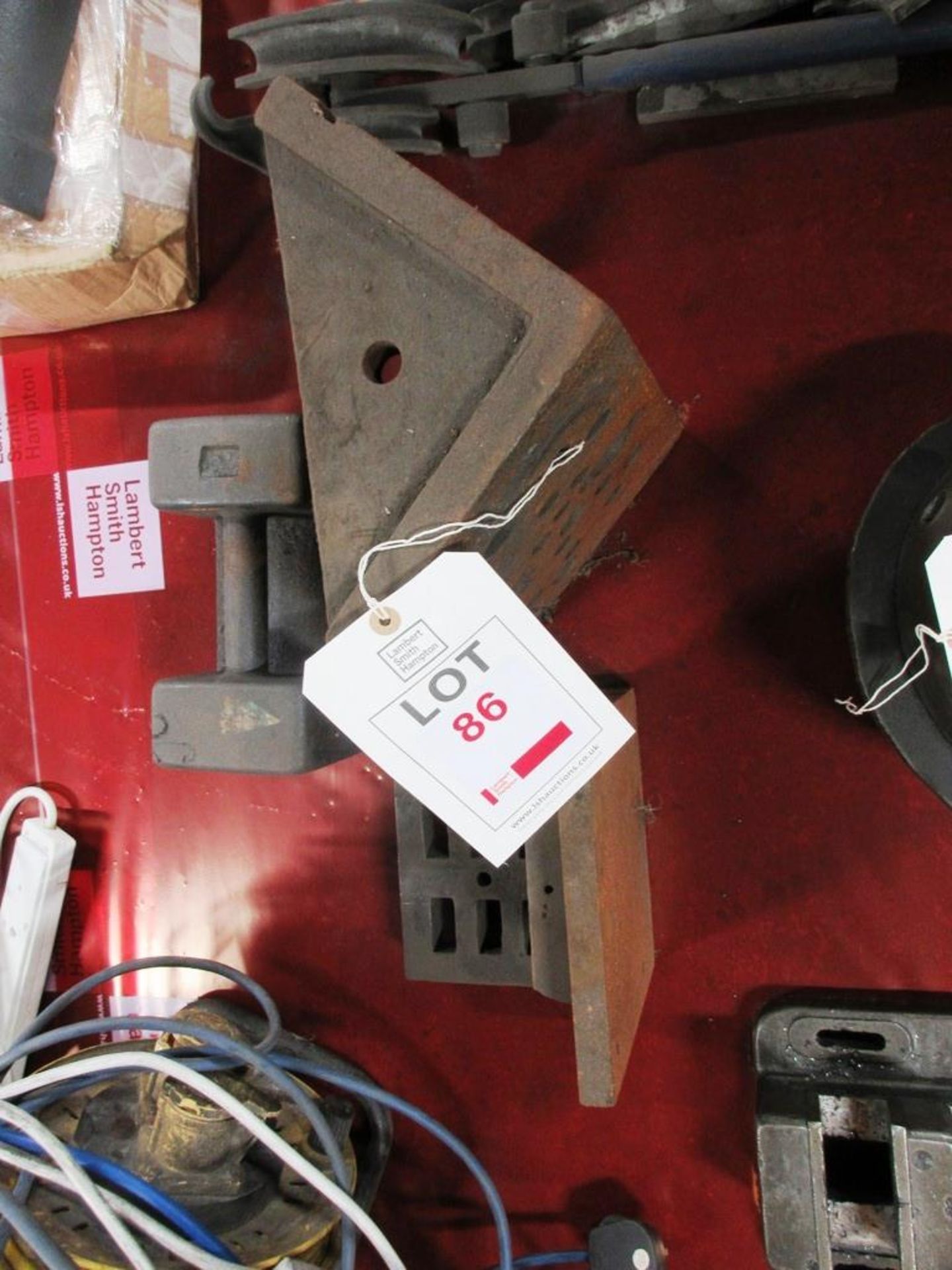 Three assorted angle plates, one 20kg weight