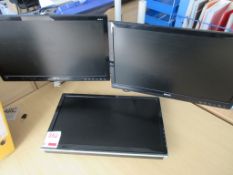 Three assorted Benq flatscreen monitors with desk clamps