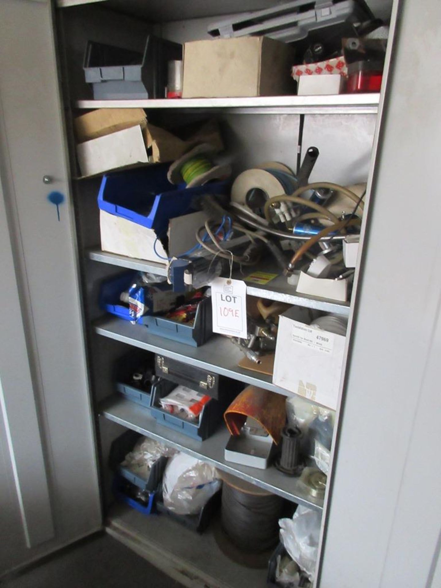 Cupboards and contents including various machine parts, pipe clips, push fit connectors, circlips,