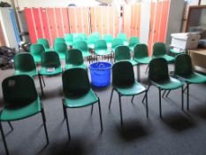 Twenty nine plastic stacking chairs