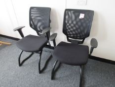 Two mesh back upholstered seat meeting chairs