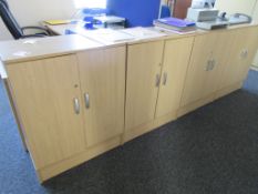 Four wood effect 2-door half height storage cupboards