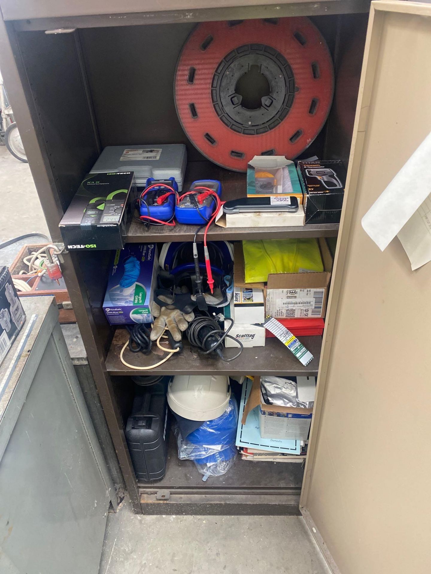 Metal cabinet and contents to include various electrical testers heat gun hardhats and a 2 draw tool - Image 2 of 4