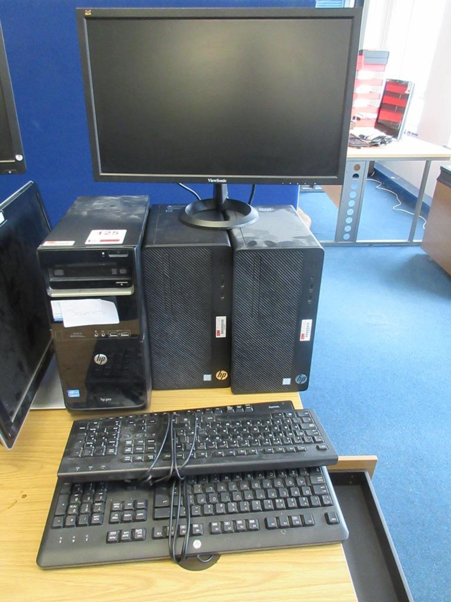 Three HP Core i3 computer systems, 2 x flat screen monitors, 3 x keyboards