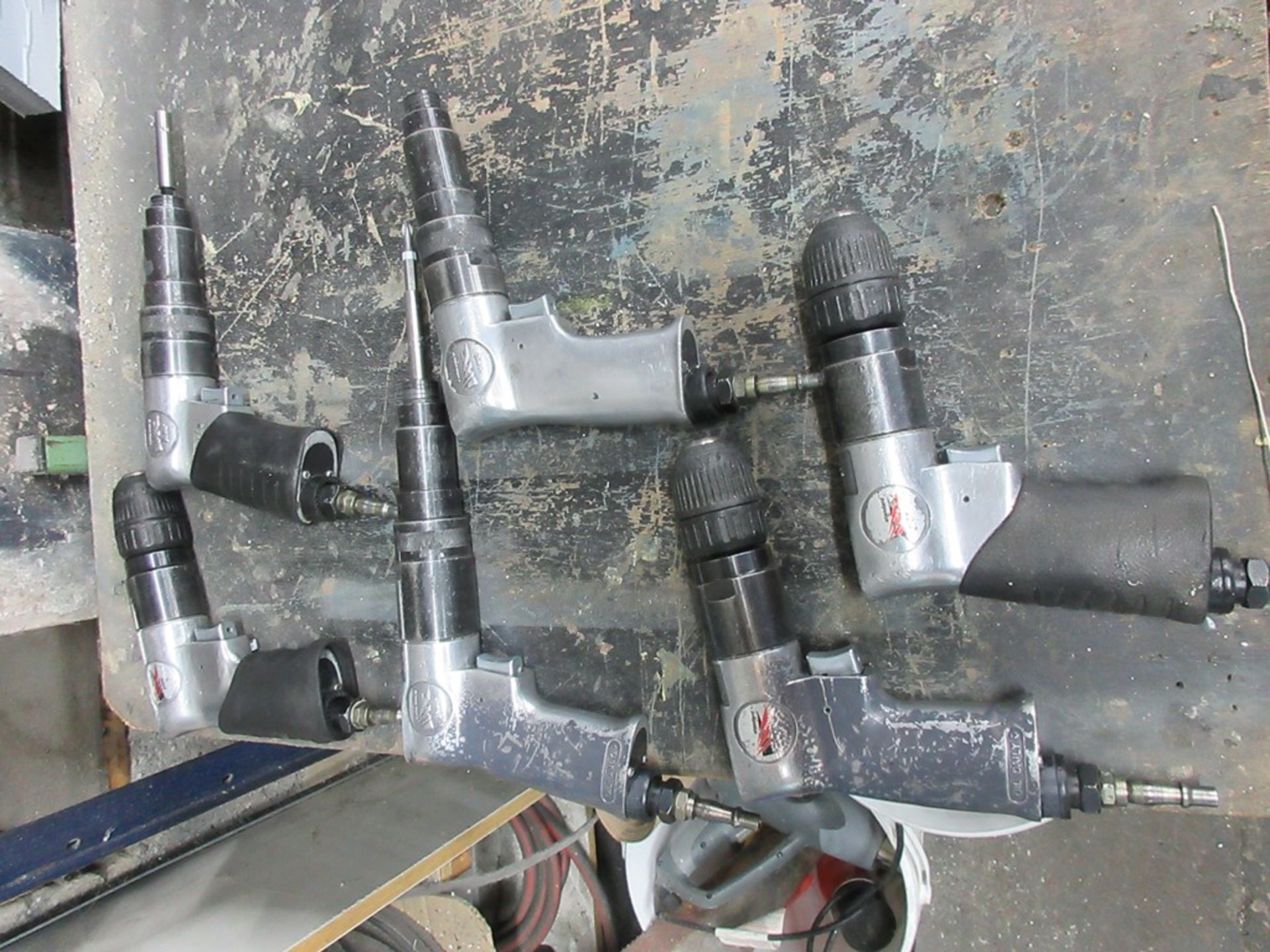Six assorted pneumatic hand tools