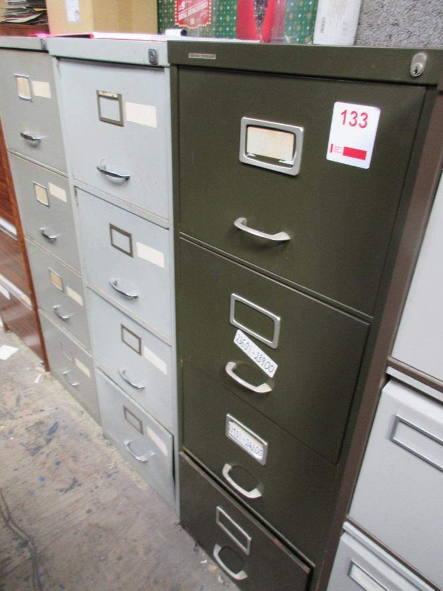 Three metal 4 drawer filing cabinets