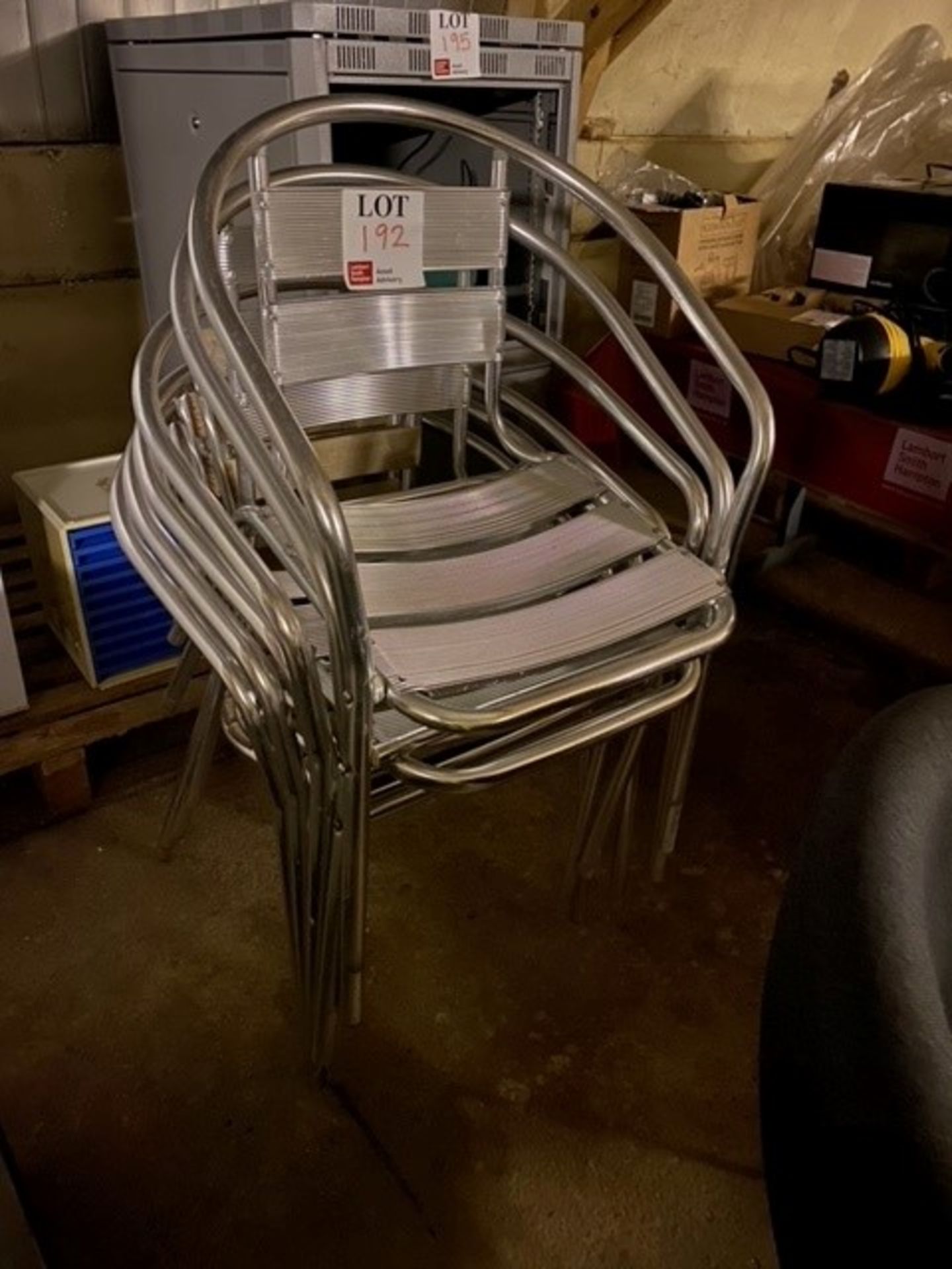 Four metal bistro chairs