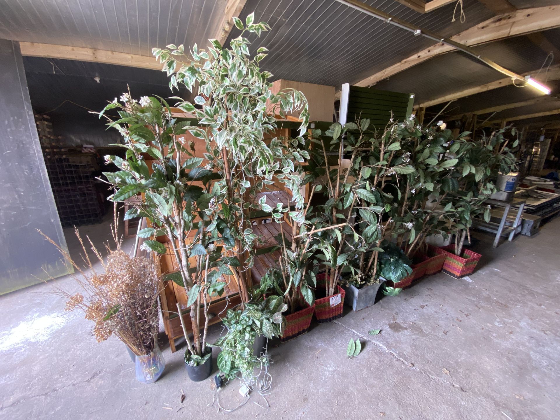 Eleven artificial plants with pots