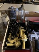 Assorted mannequin clamps and two disinfectant jars