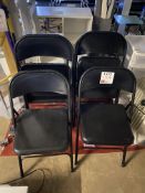 Six folding black chairs