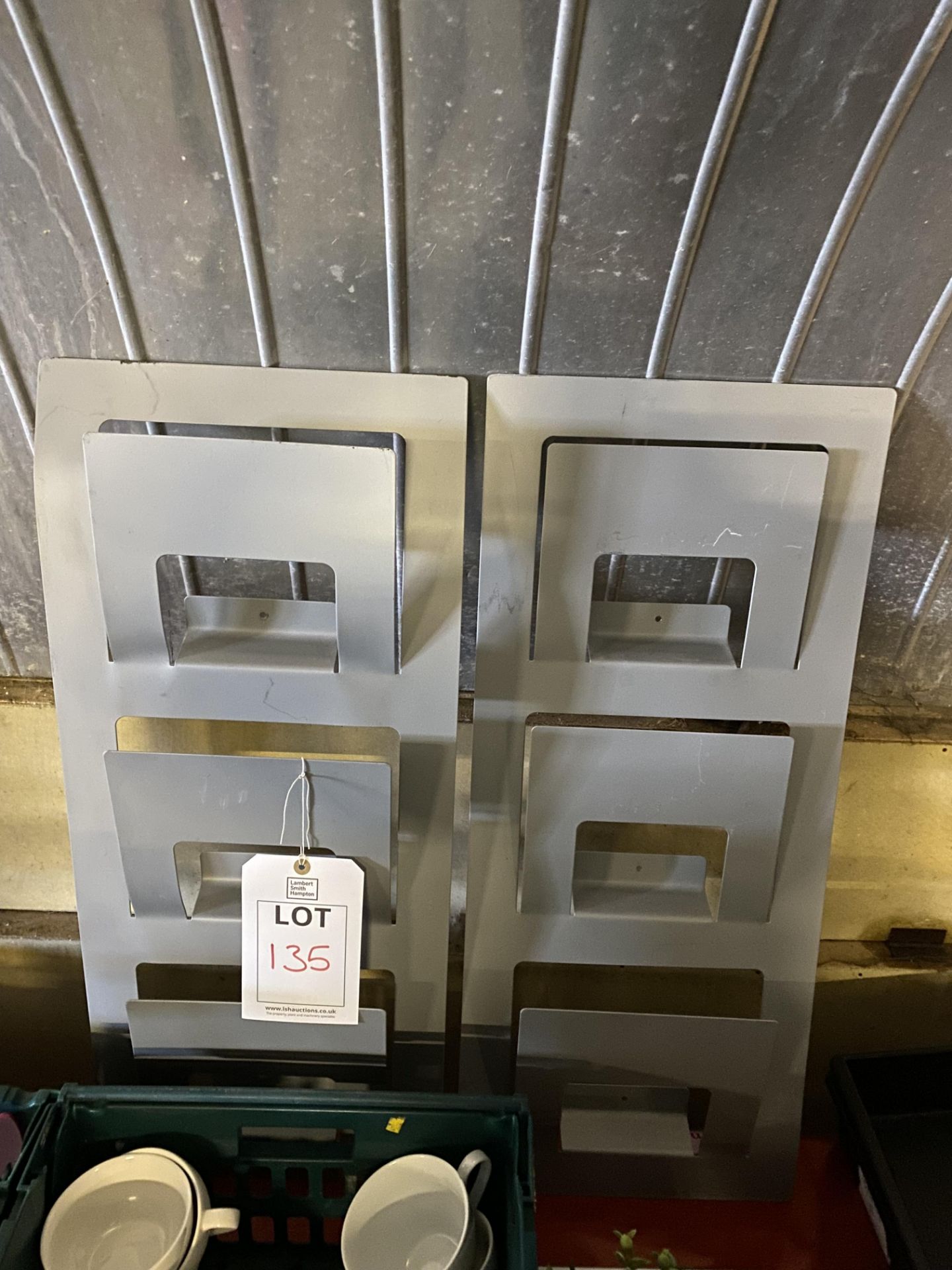 Two metal magazine racks