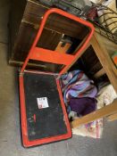 Small metal framed red trolley