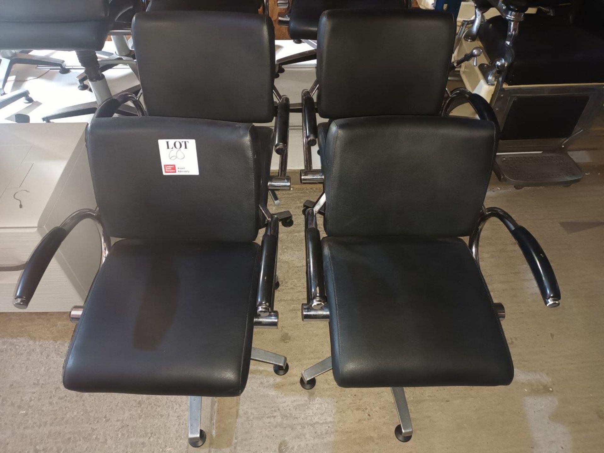 Four Welonda Wella black leather upholstered hydraulic salon chairs