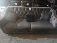 Velour upholstered two seater settee with three cushions