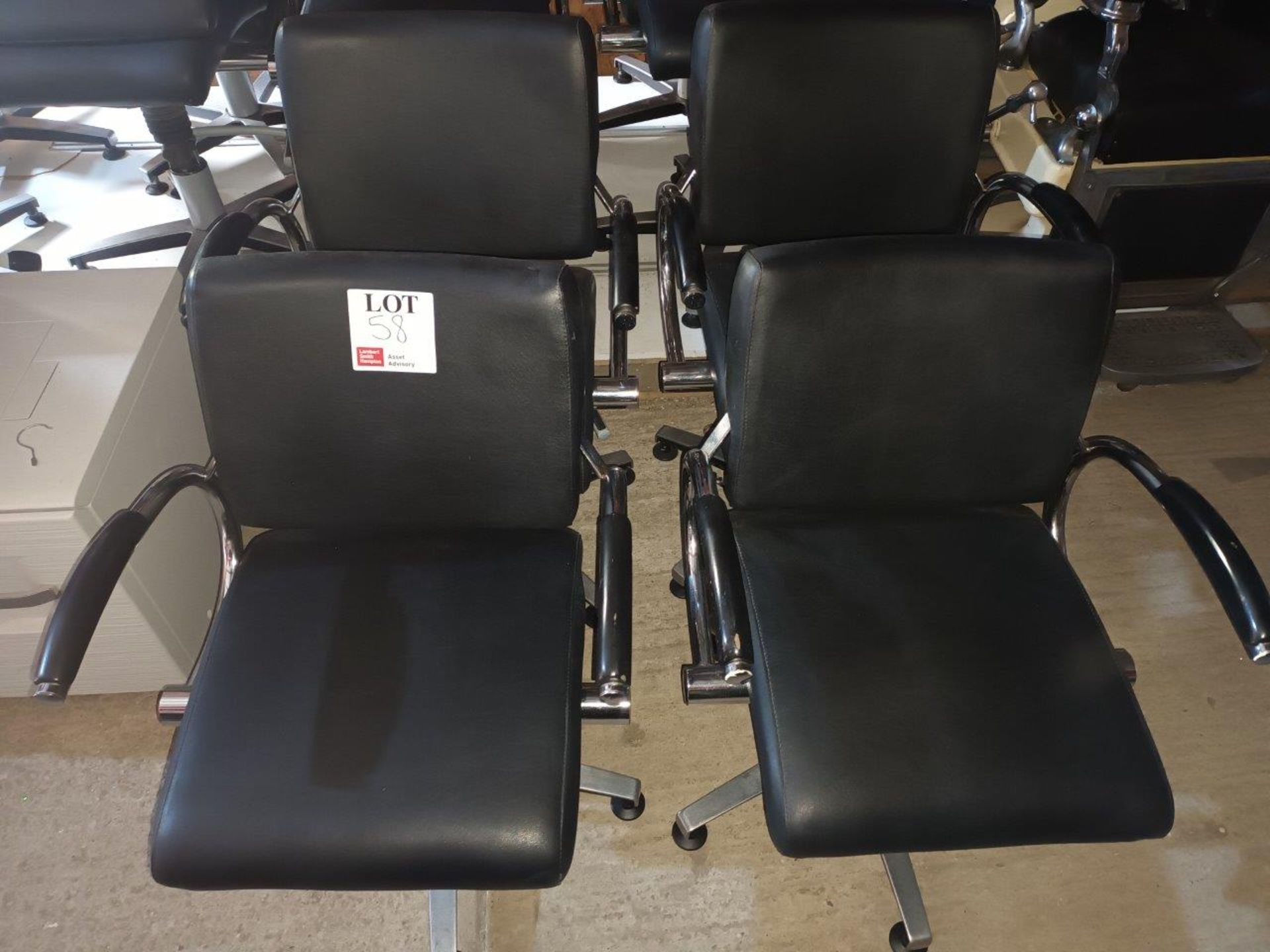 Four Welonda Wella black leather upholstered hydraulic salon chairs