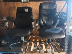 Two black leather upholstered operatives chairs