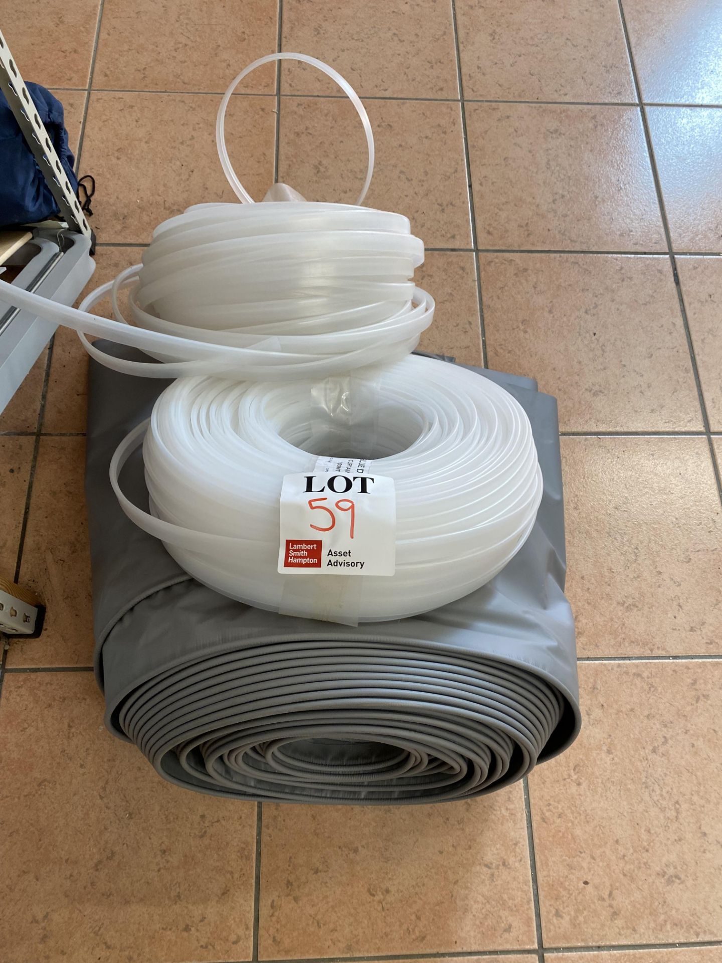 Approx 20m of awning skirt and one reel of plastic / rubber trim