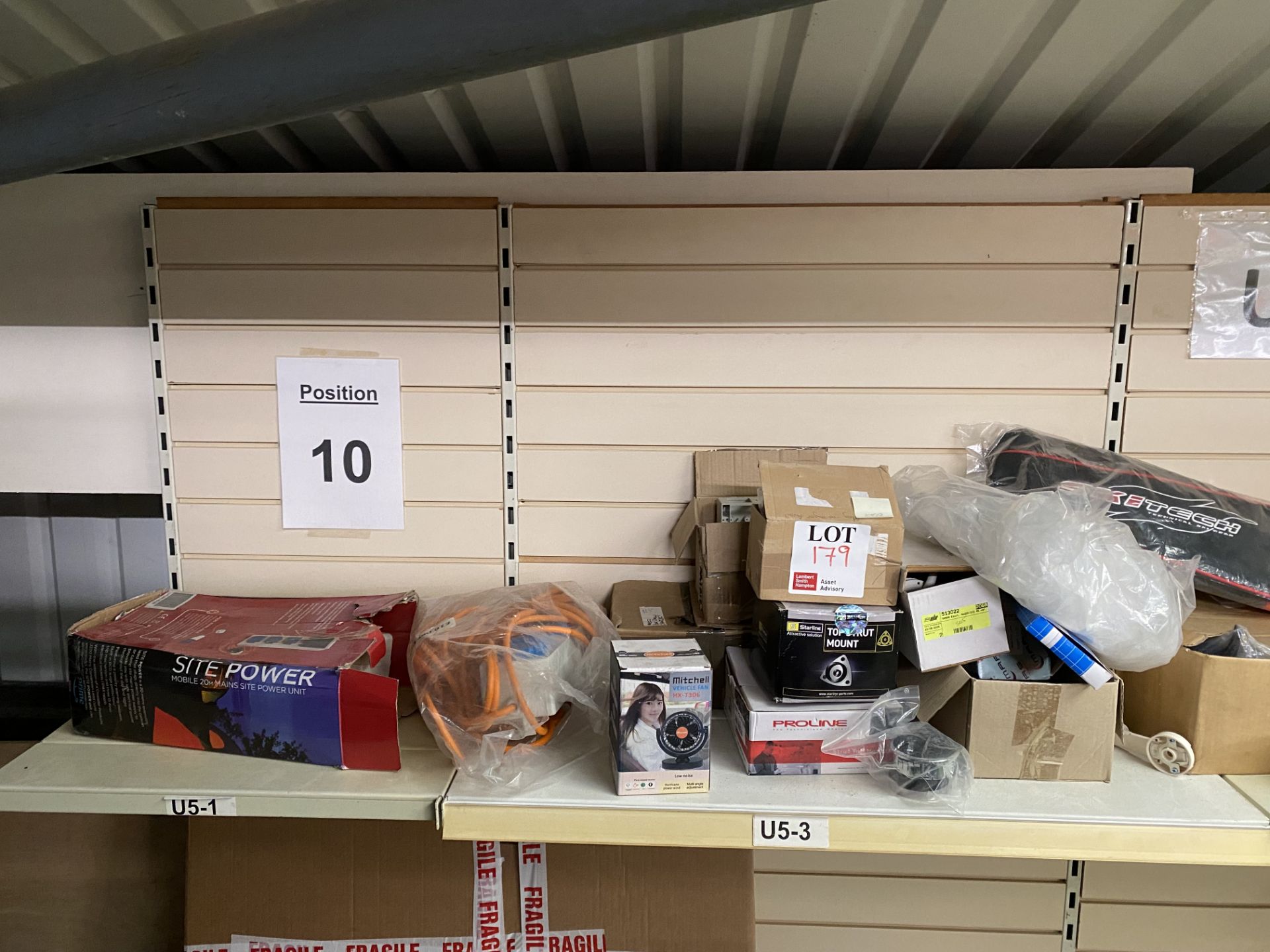 Contents of shelf to include motorhome accessories, electrical mobile mains site power unit, 20m