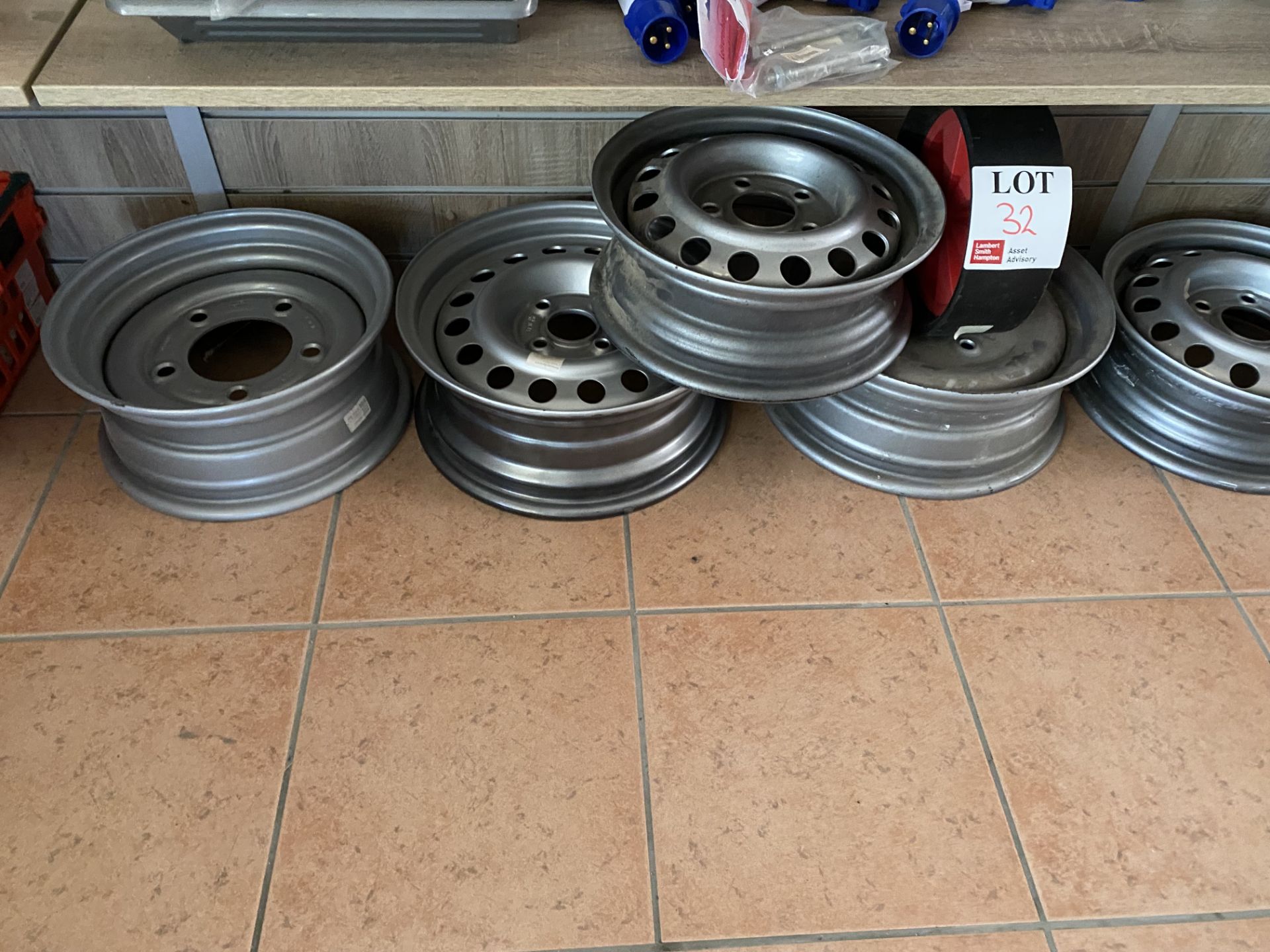 Seven various sized alloys and two plastic wheels