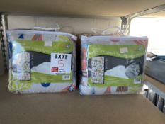 Four child sleeping bags and pillows