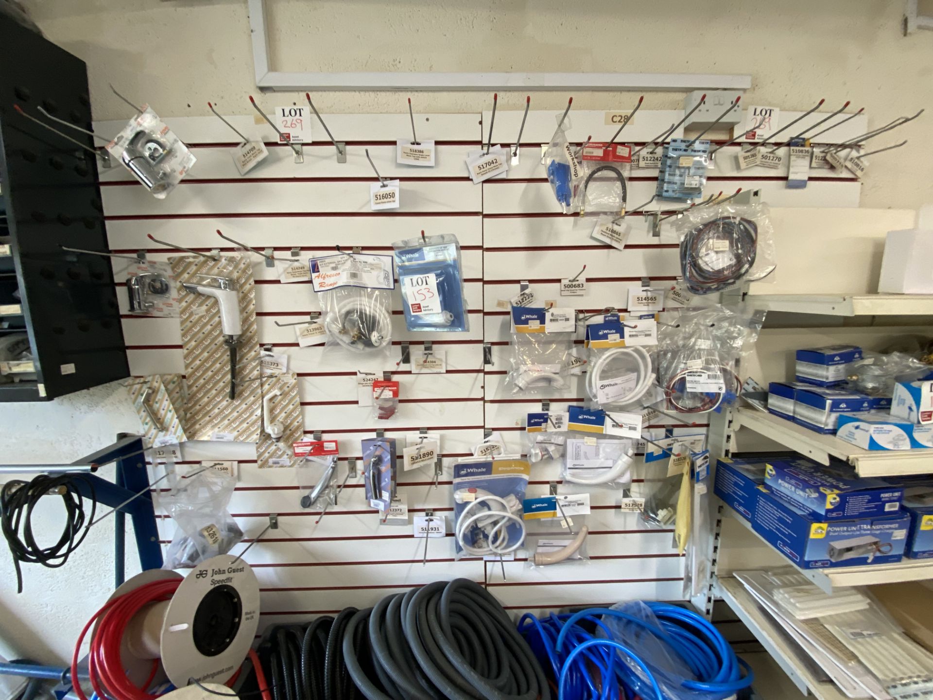Approx 2.3m of wall mounted shop display hanging rack, excluding contents (please note: to be